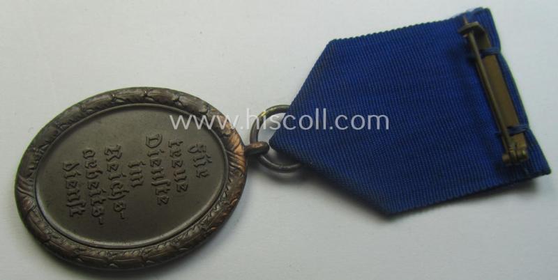 RAD (ie. 'Reichsarbeitsdienst'): 'Dienstauszeichnung 4. Stufe für Männer' as was intended for 4 years loyal-service and that comes mounted onto its period (broad-sized) ribbon (ie. 'Bandabschnitt')