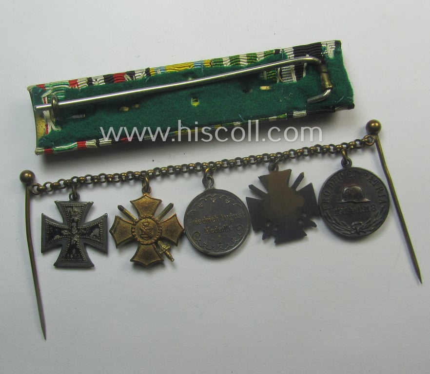 Three-pieced, (pre) 'WWI'-related medal-bar grouping (ie. 'Ordenspange-Satz') resp. depicting a WWI-period: 'EKII. Kl.', a: Sachs. 'Ehrenkreuz mit Schw.', a: 'Friedrich August Medaille in Silb.', a: 'FKK 1914-18' and an Austrian WWI-comm. medal