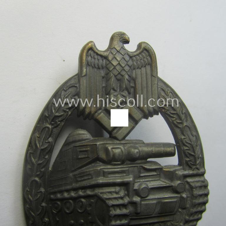 'Panzerkampfabzeichen in Bronze' (or: bronze-class panzer assault-badge or PAB) being a neat (I deem) somewhat later-war-period zinc- (ie. 'Feinzink'-) version as was procuced by the: 'Frank u. Reif'-company