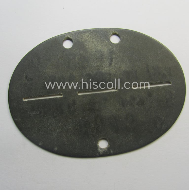 Zinc-based, WH (Heeres-) transport ie. 'Nachshub'-related ID-disc, bearing the clearly stamped unit-designation: 'St.K/Kf.Ers.Abt. 6'