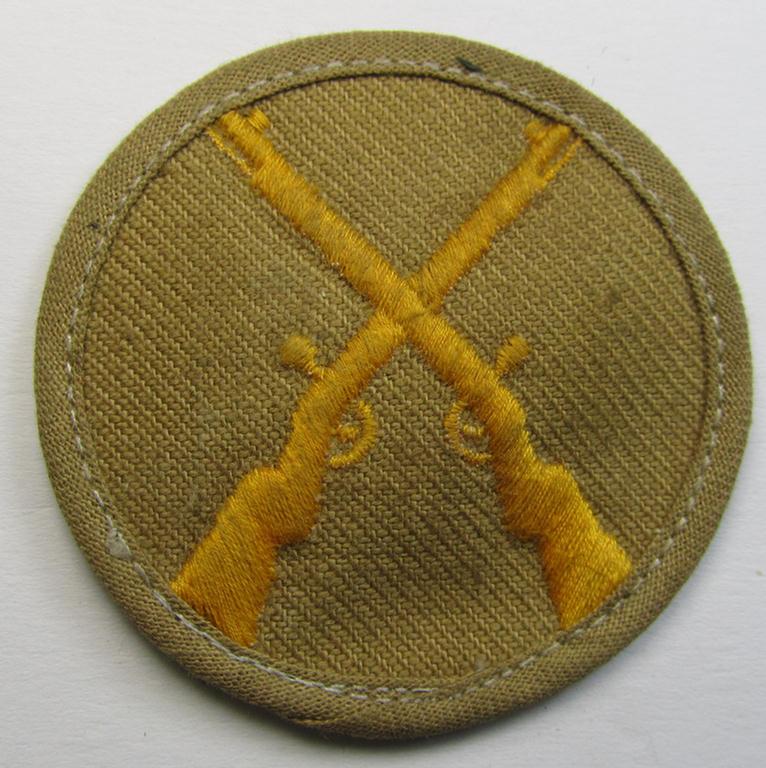 Attractive, WH (Heeres) 'tropical-style' trade- and/or special career insignia (ie. machine-embroidered speciality arm-patch) as intended for a: 'Waffenmeister' (or weapon-equipment NCO)