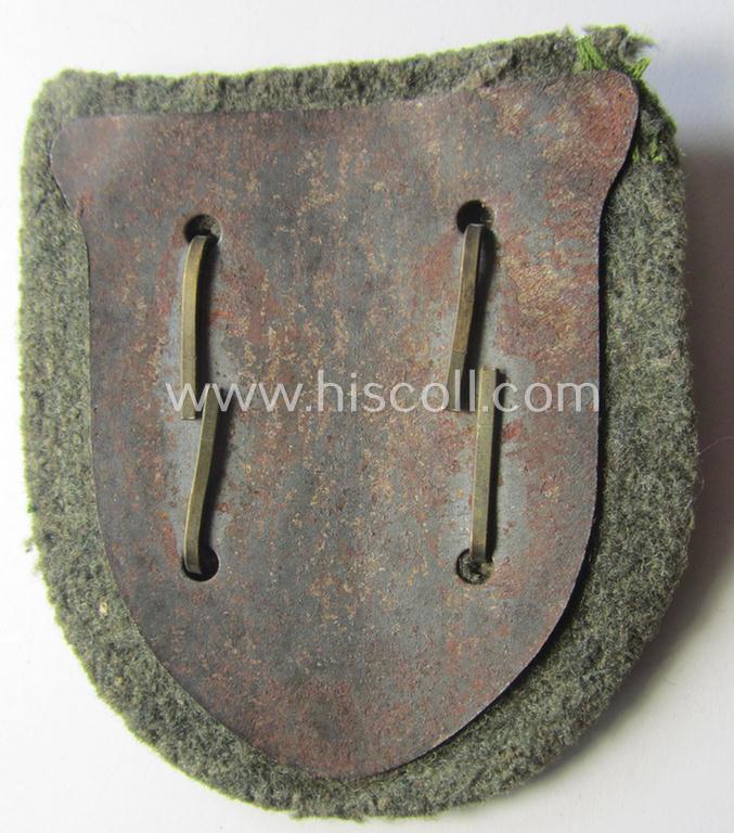 Attractive - truly worn! - WH (Heeres o. Waffen-SS) 'Krim'-campaign-shield that comes mounted onto its original, field-grey-coloured 'backing' and that comes in a surely issued-, worn and/or carefully tunic-removed-, condition