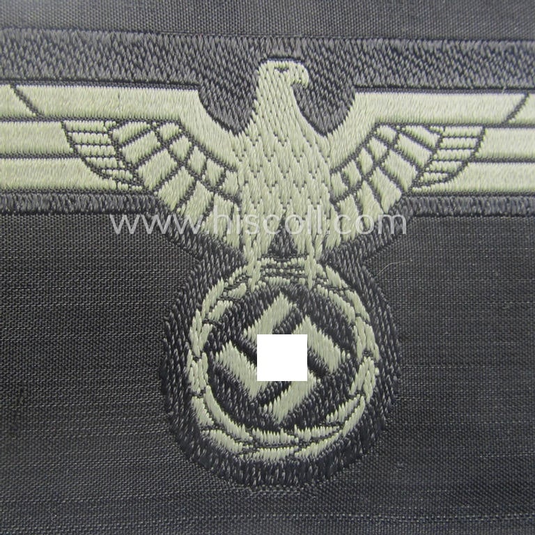 Later- (ie. mid-war-) period, WH (Heeres) 'Panzer'-type breast-eagle (ie. 'Brustadler für Panzertruppen') being a 'virtually mint- ie. unissued' example as executed in bluish-grey-coloured linnen on a black-coloured background