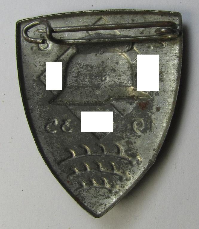 Commemorative - and unusually seen! - tin-based- and/or: bright silver-toned N.S.D.A.P.-related 'tinnie' showing an illustration of a 'Stahlhelm' and swastika-device flanked by the date: '2.6.1935'