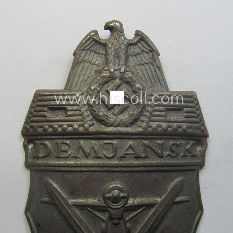 Nicely preserved - albeit regrettably incomplete ie. relic! - example of a WH (Heeres ie. Waffen-SS) 'Demjansk'-campaign-shield as executed in typical magnetic, so-called: 'Eisenblech'