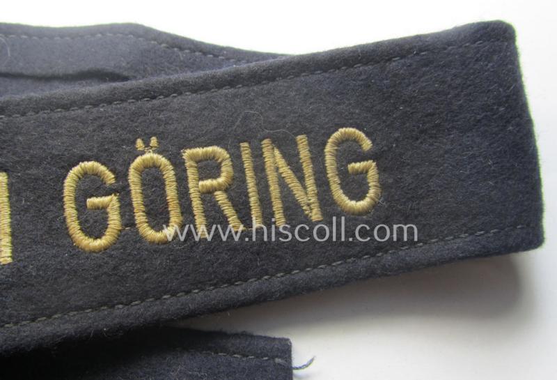 Typical 'smooth-woolen'-based, enlisted-mens'- (ie. NCO-) pattern WH (Luftwaffe) cuff-title (ie. 'Ärmelstreifen') entitled: 'Hermann Göring' (being an I deem presumably issued- albeit never worn nor tunic-attached and minimally damaged example...