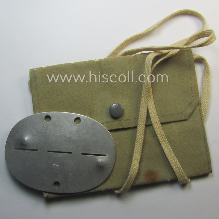 Aluminium-based, WH (Heeres-) signals'- (ie. 'Nachrichten'-) related ID-disc bearing the clearly stamped unit-designation: '3./N.Ers.Abt. 9' and that comes stored in its period-pouch as issued and/or worn