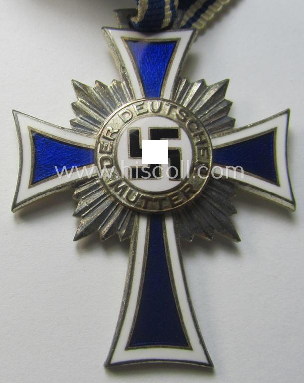 'Ehrenkreuz der deutschen Mutter - zweite Stufe' (or: silver-class mothers'-cross) that came mounted onto its long-sized ribbon and that came stored in its period pouch by the (unusual!) maker: 'Werner Redo - Saarlautern'