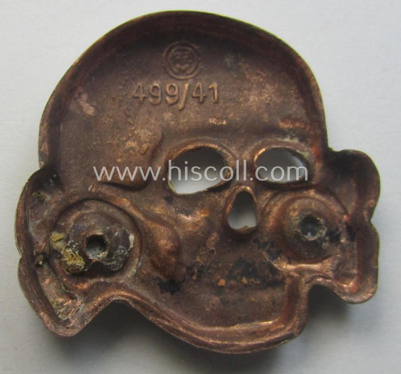 Superb - albeit regrettably incomplete but nevertheless rarely encountered! - 'Waffen-SS' visor-cap skull (ie. 'Totenkopf für Schirmmütze') being a detailed- and/or maker- (ie. 'RzM 499/41'-) marked example as was executed in 'Cupal'-based me...