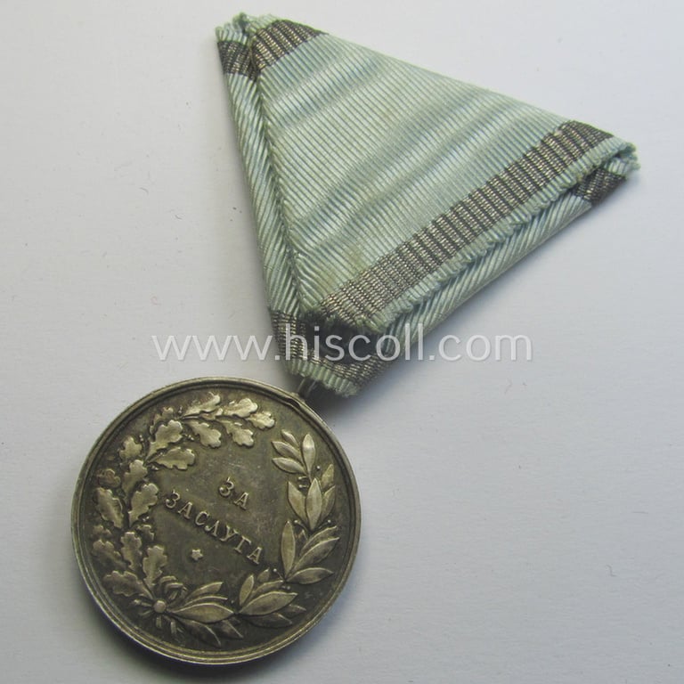 Silver-toned, Bulgarian (pre) WWII-period, military-medal: 'For Merit' (or: in Bulgarian- ie. Cyrilic language: 'Za Zaluga') showing the portrait of King Boris III