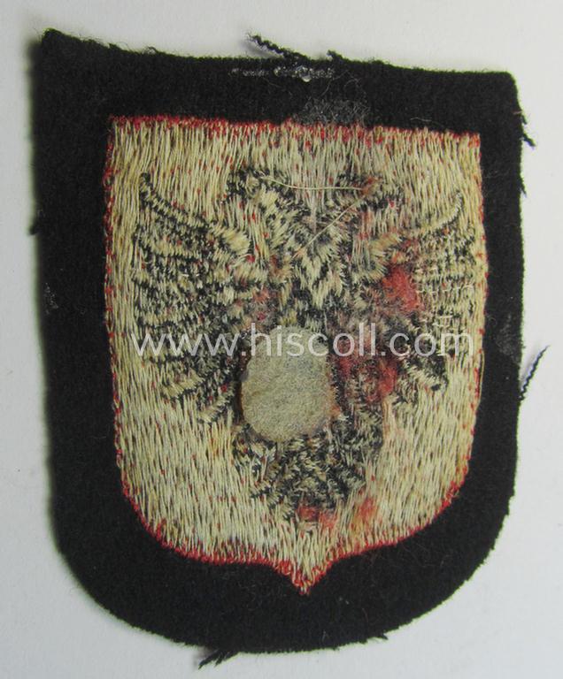 Waffen-SS 'volunteer'-arm-shield as was intended for usage by soldiers of the: '21. Waffen-Grenadier-Division der SS' “Skanderbeg” (ie. 'albanische Nr. 1') and that comes in a 'virtually mint- ie. unissued', condition