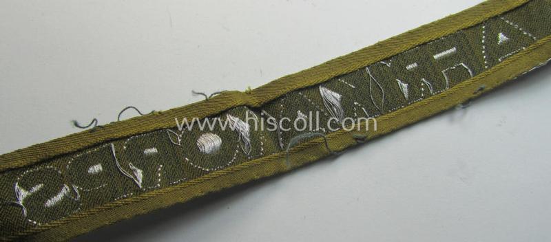 Attractive, 'BeVo'-like cuff-title (ie. 'Ärmelstreifen') entitled: 'Afrikakorps' being a with certainty issued and truly worn example that comes in an overall nice- (ie. hardly shortened- and/or once tunic-attached-), condition