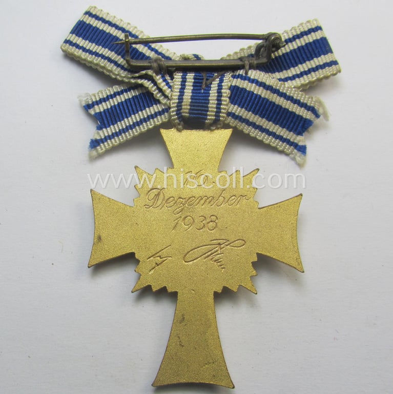 'Ehrenkreuz der deutschen Mutter - erste Stufe' (or: golden-class mothers'-cross) being a hardly used example that comes mounted onto its (unusually confectioned!) ribbon as issued and/or recently found