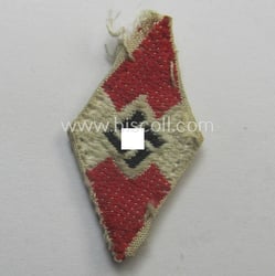 Truly used- and/or cap-removed, HJ (ie. 'Hitlerjugend') cap-badge...