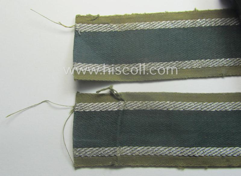 Truly worn, 'BeVo'-like cuff-title (ie. 'Ärmelstreifen') entitled: 'Afrikakorps' being a with certainty issued example that comes in an overall nice- (ie. hardly shortened- and/or once tunic-attached-), condition