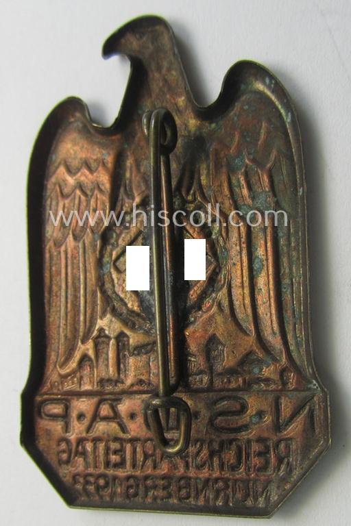 Attractive, N.S.D.A.P.-related 'tinnie' (ie. 'Tagungs- o. Veranstaltungsabzeichen'-) being a non-maker-marked, 'hollow-back'-pattern and golden-bronze-toned example showing the text: 'N.S.D.A.P. Reichsparteitag - Nürnberg 1933'