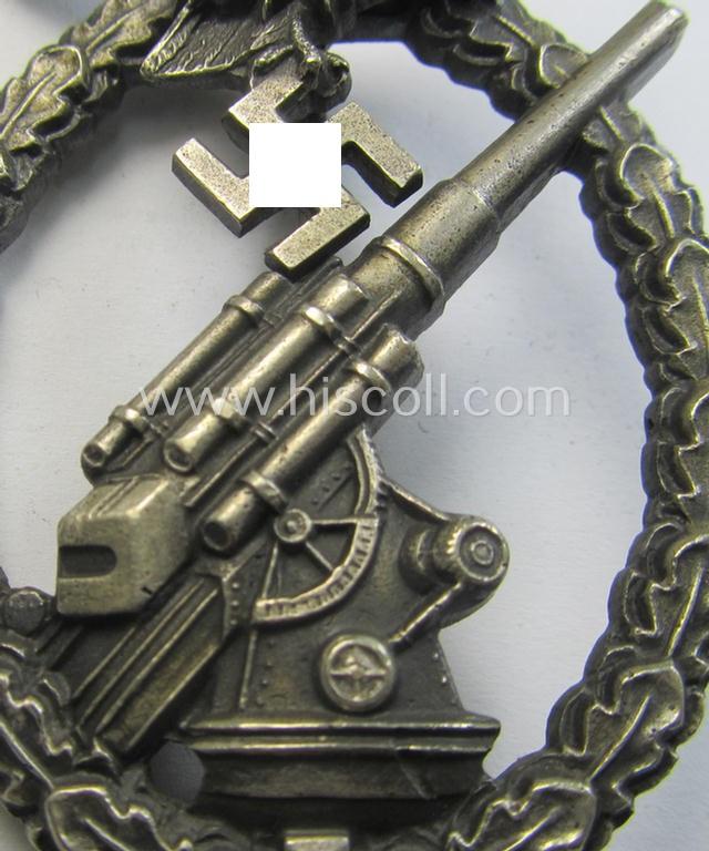Attractive, WH (Luftwaffe) 'Flakkampfabzeichen' being a detailed 'Buntmetall'-based and (unusually seen!) non-maker-marked example as was produced by the: 'C.E. Juncker'-company and that comes as moderately worn