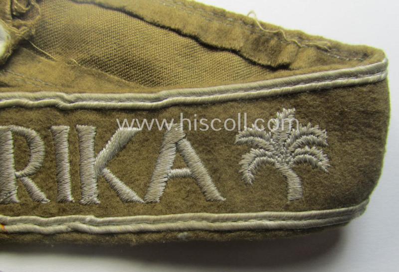 Moderately used, WH cuff-title (ie. 'Ärmelstreifen') entitled: 'Afrika' (being a hardly shortened example that comes in an overall very nice- (ie. issued and clearly worn ie. once tunic-attached-), condition