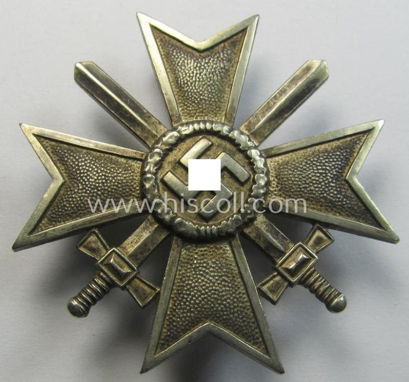Attractive - and just moderately used- ie. worn! - 'Kriegsverdienstkreuz 1. Klasse mit Schwertern' being a non-maker-marked specimen that is executed in typical, silverish-coloured metal (ie. 'Buntmetall')