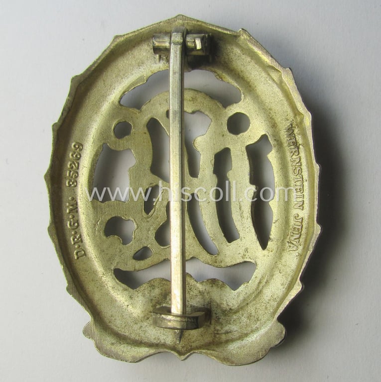 'Reichssportabzeichen DRL in Silber' (or: silver-class DRL sports'-badge) being a maker- (ie. 'Wernstein - Jena'-) marked example and that comes with its accompanying miniature
