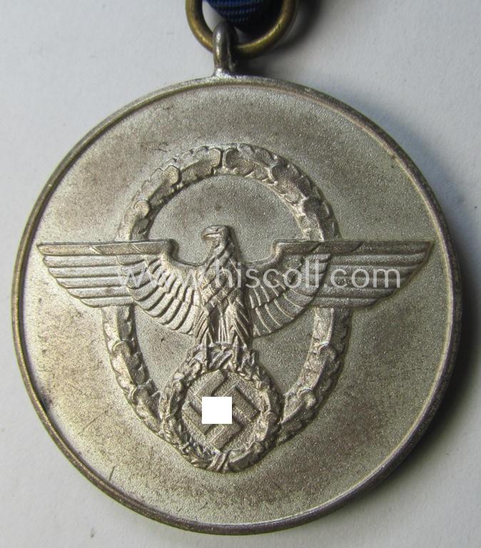 Bright-silver-toned so-called: 'Polizei-Dienstauszeichnung 3. Stufe' (or: police loyal-service medal 3rd class) that comes mounted onto its period ribbon (ie. 'Bandabschnitt')