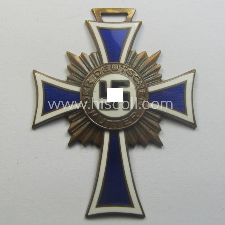 'Ehrenkreuz der deutschen Mutter - dritte Stufe' (or: bronze-class mothers'-cross) that came together with its long-sized (and mint!) ribbon and that came stored in its period pouch (by the maker: 'Friedrich Keller - Oberstein')