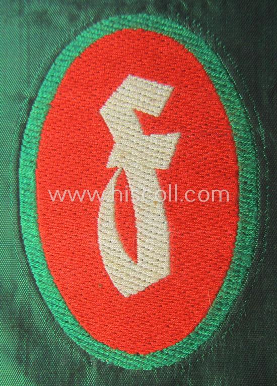 Attractive, 'Sicherheits- u. Hilfsdienst (SHD)' armbadge (ie. 'Ärmelabzeichen') as executed in 'BeVo'-weave pattern, as was intended for an SHD-member who served within the: 'Feuerlöschdienst' (or: fire-extinction-service)