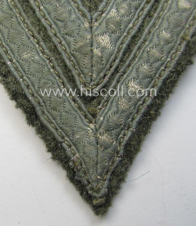 WH (Heeres) 'Armwinkel' (or: arm-chevron) as executed on typical field-grey-coloured wool as was specifically intended for usage by a soldier with the rank of: 'Obergefreiter'