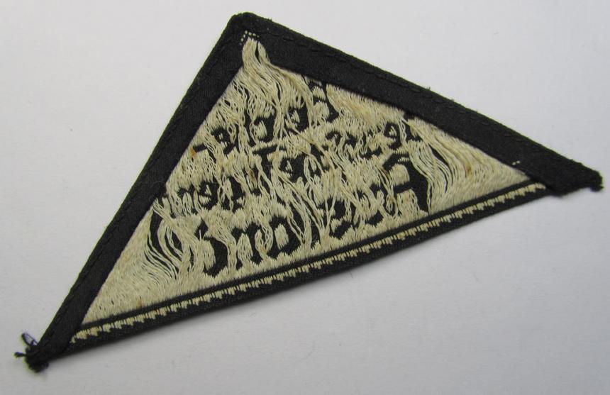 Superb - and extremely rarely encountered! - HJ/BDM (ie. 'Hitlerjugend' or: 'Bund Deutsche Mädel') district-triangle (ie. 'Gebietsdreieck') entitled: 'Reichs-deutsche Jugend Ausland' being a used specimen that misses its 'RzM'-etiket