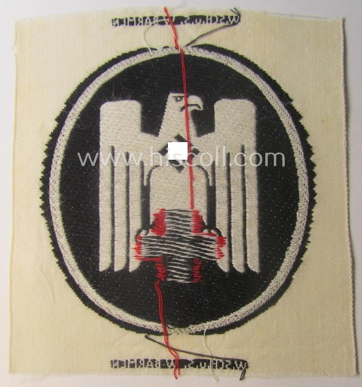 Neat - and actually scarcely encountered! - somewhat larger-sized DRK- (ie. 'Deutsches Rotes Kreuz'-) related sport-shirt emblem as was executed in the neat 'BeVo'-weave-pattern and that comes in a 'virtually mint' condition