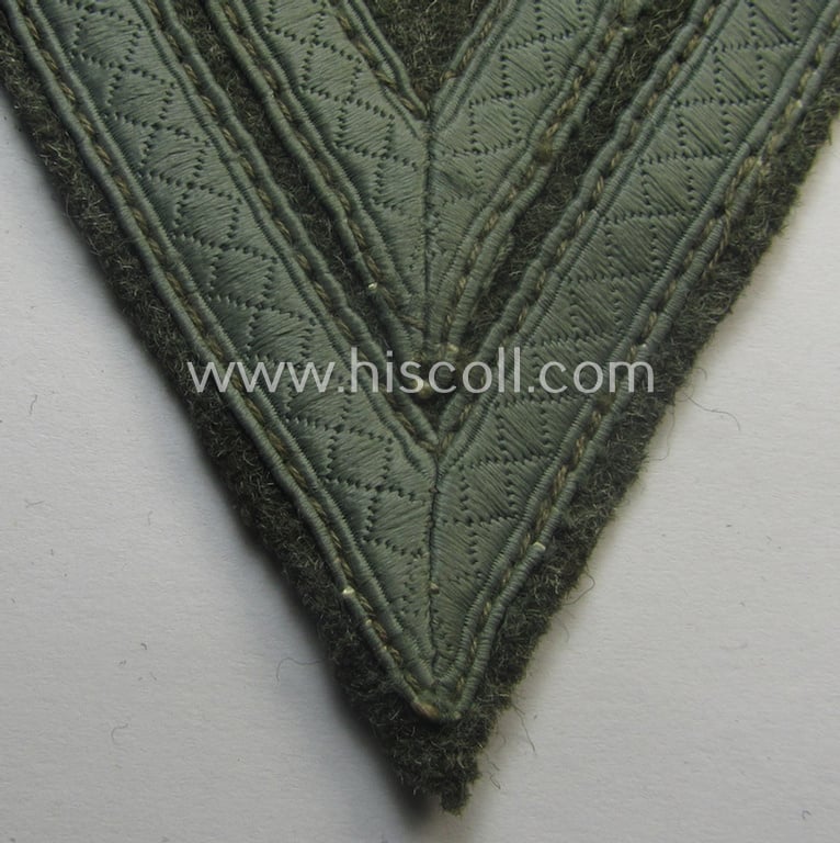 WH (Heeres) 'Armwinkel' (or: arm-chevron) as executed on typical field-grey-coloured wool as was specifically intended for usage by a soldier with the (unusually encountered!) rank of: 'Stabsgefreiter'