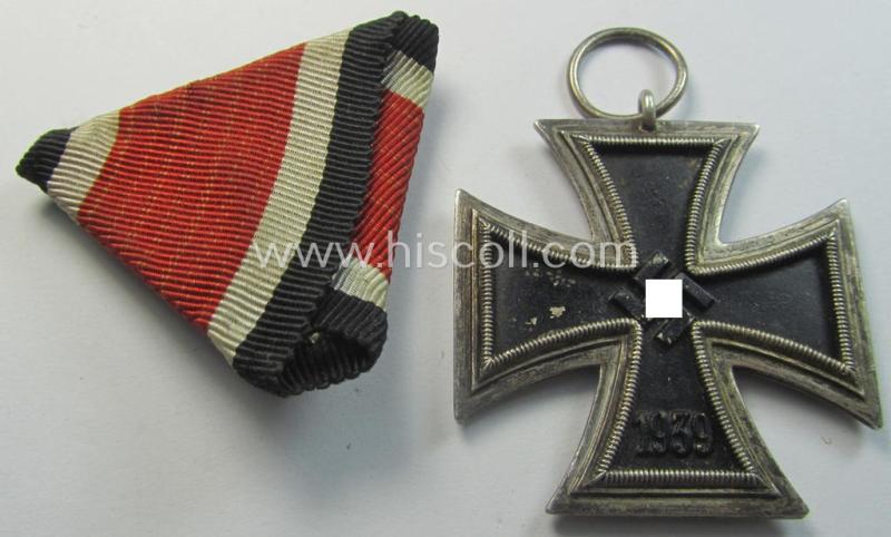 Neat, Iron Cross 2nd class (or: 'EK II. Klasse') being a non-maker-marked example that comes mounted onto its original (Austrian-styled!) ribbon (ie. 'Bandabschnitt') as was (I deem) produced by the (Austrian-based) company named: 'Rudolf Souval...