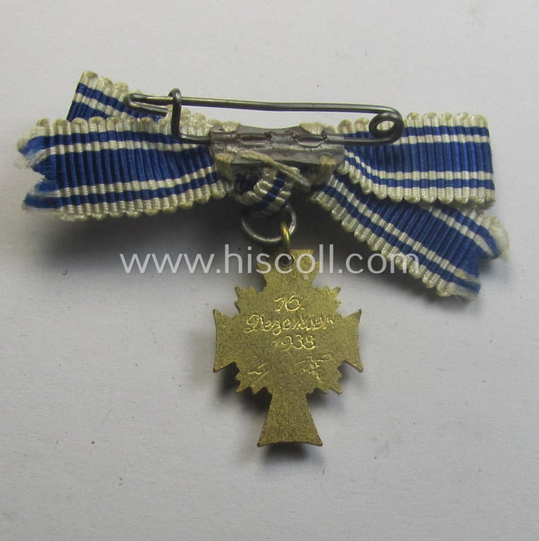 Miniature of an: 'Ehrenkreuz der deutschen Mutter - erste Stufe' (or: golden-class mothers'-cross) being a non-maker-marked example that comes in an overall nice- (albeit moderately worn- ie. used-), condition