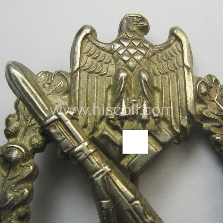 'Infanterie Sturmabzeichen in Silber' (or: silver-class infantry-assault-badge ie. IAB) being a 'Buntmetall'-based example by the: 'Otto Schickle'-company