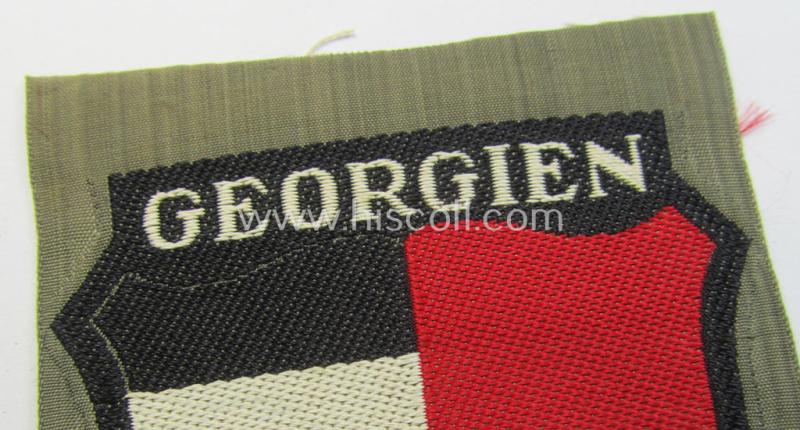 Attractive, 'BeVo'-type armshield entitled: 'Georgien' (being a 'virtually mint- ie. unissued' example as intended for a volunteer who served within the 'Deutsche Wehrmacht' ie. within the 'Georgisches Legion')