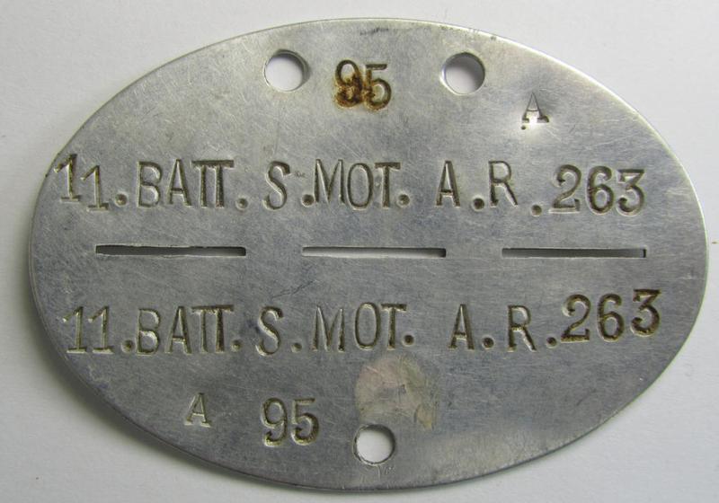 Interesting, aluminium-based WH (Heeres) ie. 'mot. Artillerie'-related ID-disc bearing the clearly stamped unit-designation: '11.Batt.S.Mot.A.R. 263' and that comes together with its 1945-dated agenda (ie. 'Kalender') as stored for decades