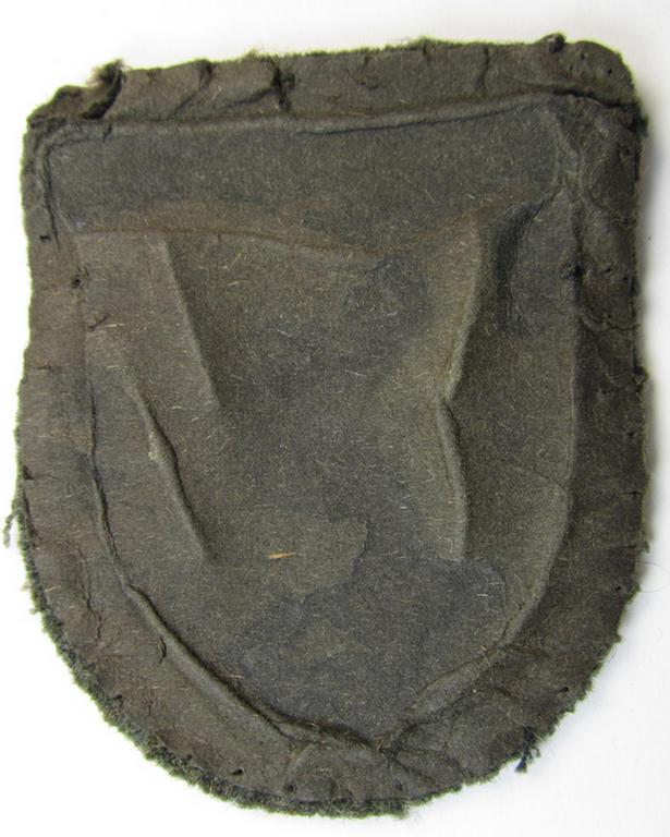 Attractive, WH (Heeres o. Waffen-SS) 'Krim'-campaign-shield that comes mounted onto its original, field-grey-coloured 'backing' and that comes in an issued-, minimally worn and/or carefully tunic-removed-, condition