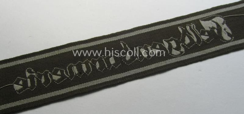 Superb - and scarcely encountered! - example of a WH (Heeres) cuff-title ie. armband (ie. 'Ärmelstreifen') entitled: 'Feldgendarmerie' (being a typical 'semi-BeVo'-woven!) example that comes in a full length- ie. non-shortened, condition