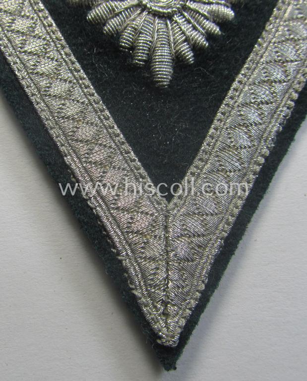 WH (Heeres) 'Armwinkel' (or: arm-chevron) as executed on typical darker-green-coloured wool as was specifically intended for usage by a soldier with the (unusually encountered!) rank of an: 'Gefreiter mit mehr als 6 Dienstjahren'