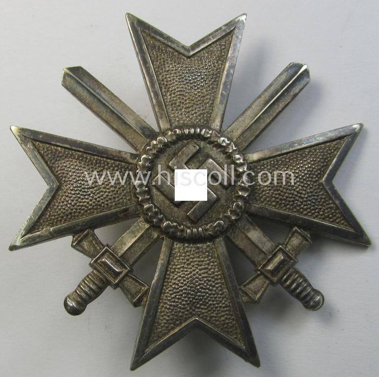 Attractive - and just moderately used- ie. worn! - 'Kriegsverdienstkreuz 1. Klasse mit Schwertern' being a non-maker-marked specimen that is executed in typical, silverish-coloured metal (ie. 'Buntmetall')