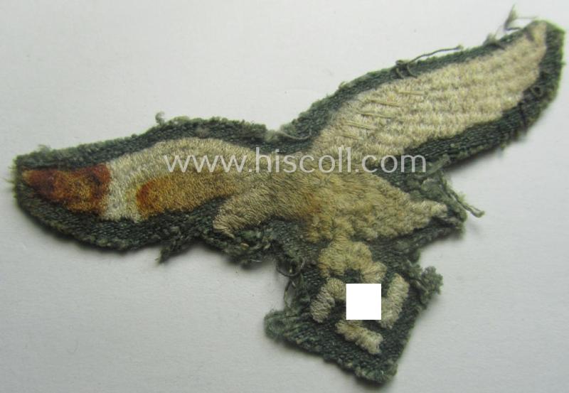 WH (Luftwaffe) machine-embroidered breast-eagle (ie. 'Brustadler für Mannschaften u. Unteroffiziere') being a clearly used example that comes mounted on a typical 'HBT'- (ie. 'Drillich'-) shaped- and/or linnen-based background