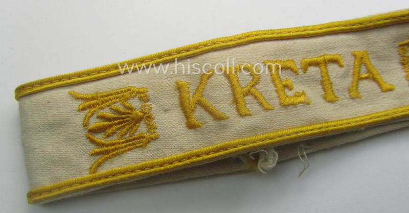 WH cuff-title (ie. 'Ärmelstreifen') entitled: 'Kreta' (being an example that bears a printed 'RbN.'-numeral and that comes in an issued-, clearly worn- and/or most certainly once tunic-attached, condition)