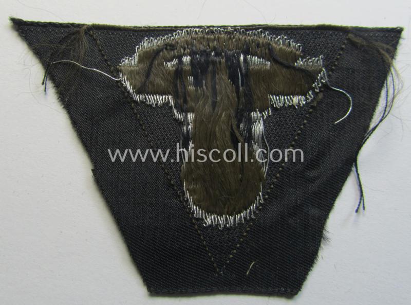 Attractive, so-called: N.S.K.K. (ie. 'National Socialistisches Kraftfahr Korps') side-cap-eagle (ie. 'Adler für N.S.K.K.-Schiffchen o. Lagermütze') being a 'flat-wire-woven'-example onto a darker-brown-coloured background