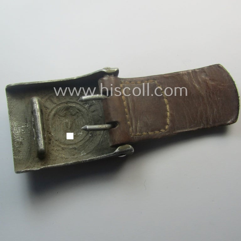 WH (Heeres) 'standard-pattern', field-grey-toned- and aluminium-based belt-buckle being a maker- (ie. 'Hermann Knoller - Pforzheim'-) marked- and/or: '1939'-dated example that comes mounted onto its leather-based tab