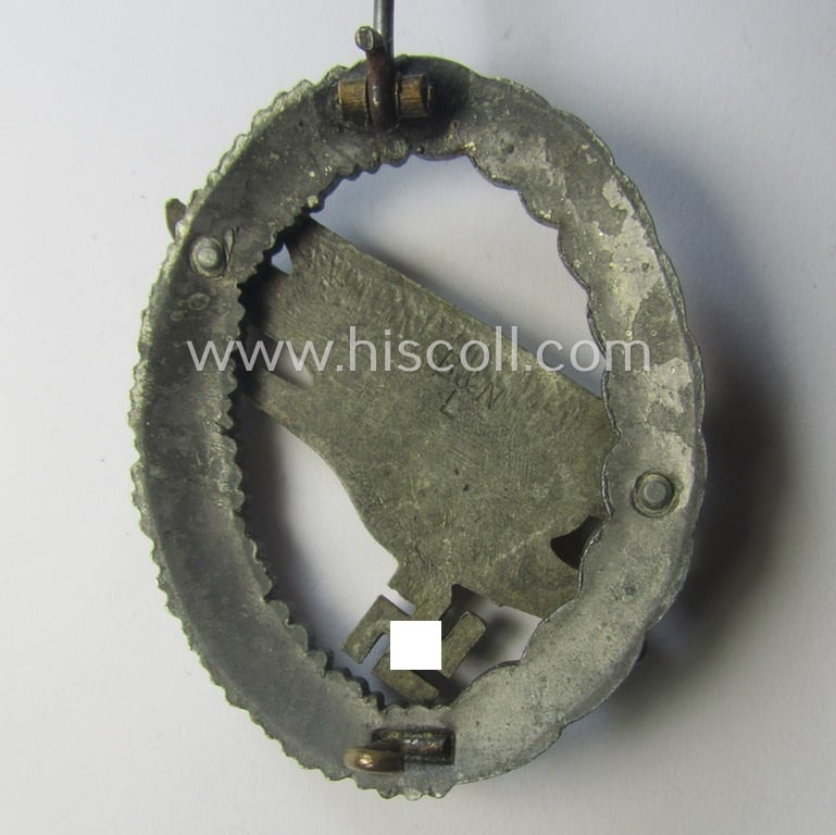 WH (Luftwaffe) 'Fallschirmschützen-Abzeichen' (or: paratroopers-jumpbadge) being a maker- (ie. 'B&N - L'-) marked- and typical zinc- (ie. 'Feinzink'-) based example by: 'Berg u. Nolte'