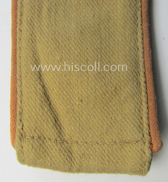 Single, WH (Luftwaffe) tropical-issued, EM-type-shoulderstrap as executed in beige-coloured linnen (as was specifically intended for usage on the tropical-shirts ie. tunics) as was intended for a: 'Soldat der Nachrichten-Truppen'