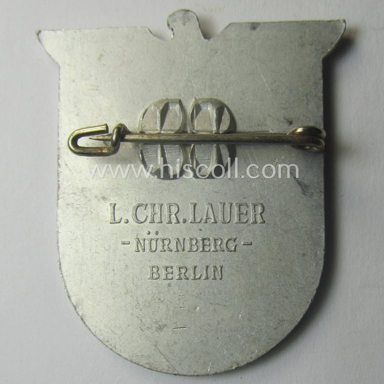 Commemorative, N.S.D.A.P.-related 'tinnie' depicting an illustration of a detailed 'Reichsadler'-device coupled with the text: 'NSDAP Gau Mecklenburg - Kreistag 1938 - Kreis Schwerin-Stadt'