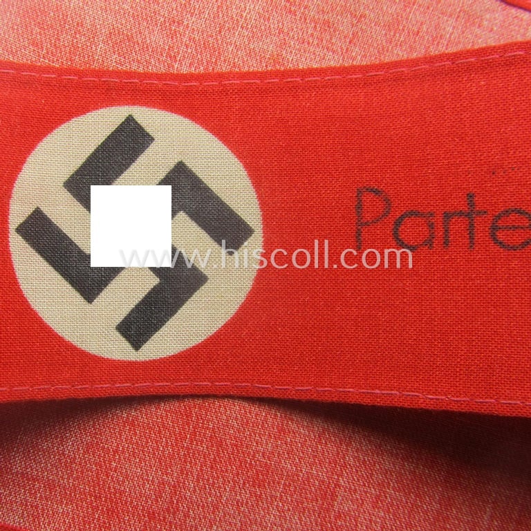 Unusually encountered - and most certainly scarcely seen! - thin-shaped, 'N.S.D.A.P.'-related armband (ie. 'Armbinde') being of the 'entirely printed'-type showing a swastika and text: 'NSDAP - Partei-Bereitschaft'