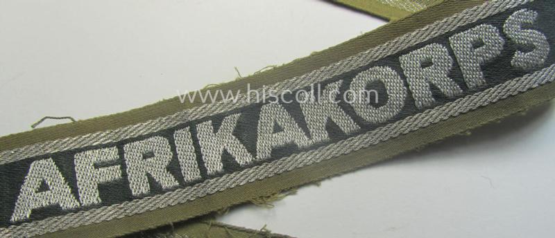 Truly worn, 'BeVo'-like cuff-title (ie. 'Ärmelstreifen') entitled: 'Afrikakorps' being a with certainty issued example that comes in an overall nice- (ie. hardly shortened- and/or once tunic-attached-), condition