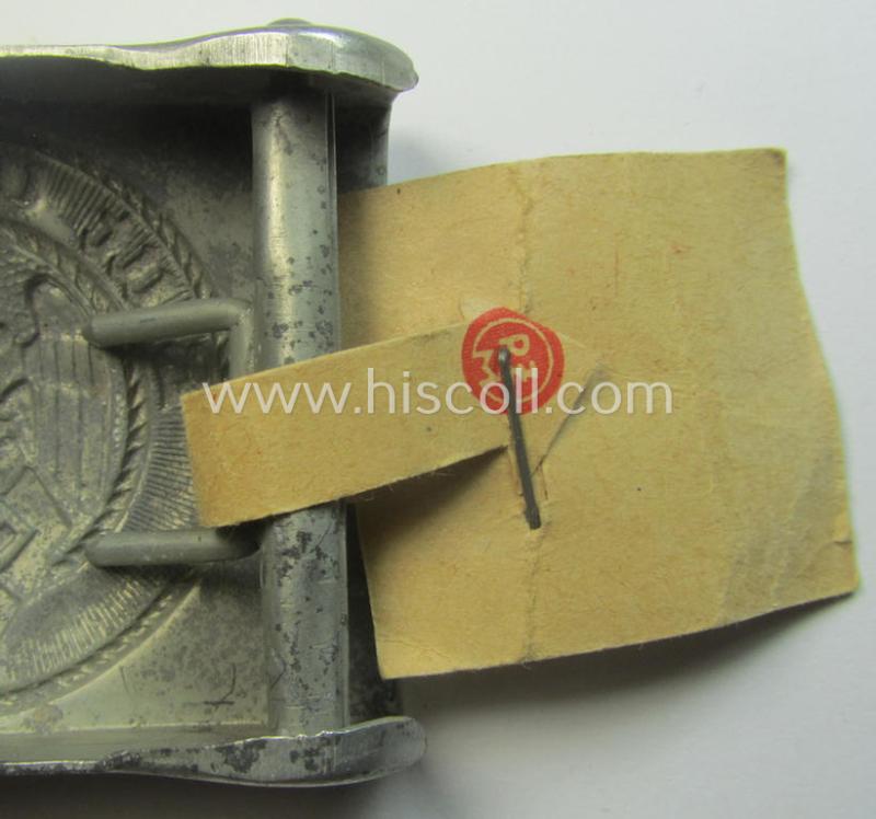 HJ ('Hitlerjugend'), zinc-based belt-buckle being a 'virtually mint' and/or non-maker-marked example having a seldomly seen 'cranked-catch'-set-up and that comes with its period 'RzM'-etiket still attached
